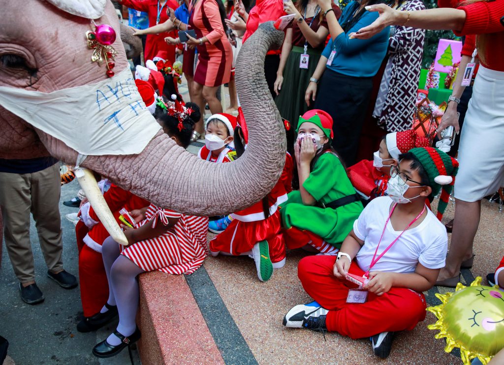 Elephant Santas pass out face masks, hand gel in Thai school tradition